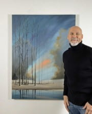 Thomas Findlay standing next to his painting